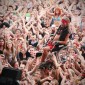 Disabled man crowdsurfing on audience at Woodstock Festival in Poland